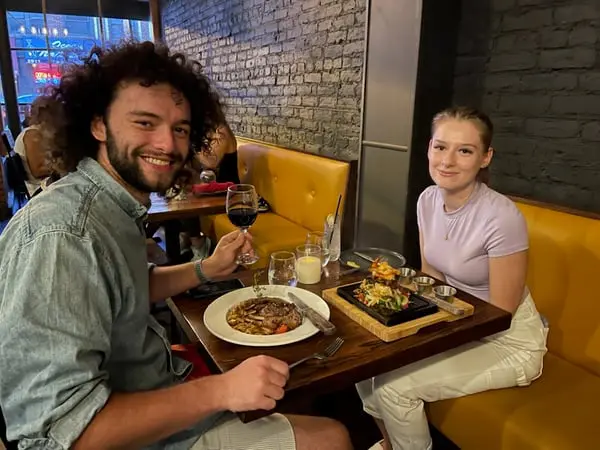 A man and a woman having their meal